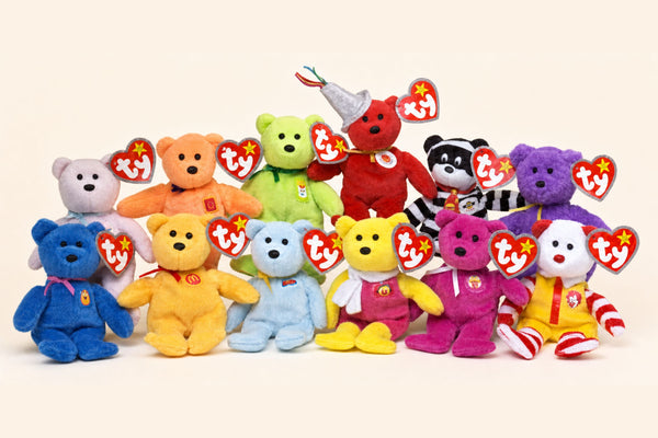 All twelve 2004 McDonald's Teenie Beanie bears with ty tags on a cream background.