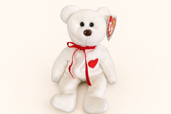 Valentino the Bear with his red embroidered heart, red ribbon, and standard brown nose.