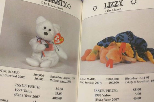 A 1990s Beanie Baby price guide book open to pages predicting huge future values for Libearty and Lizzy.