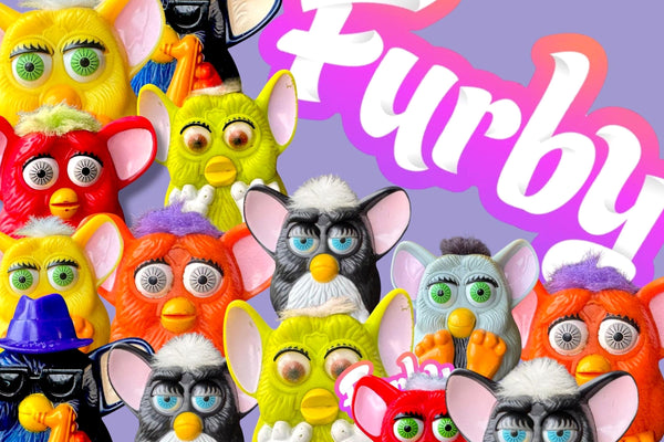 A crowd of 1999 McDonald's McFurby plastic Happy Meal toys in many colour designs