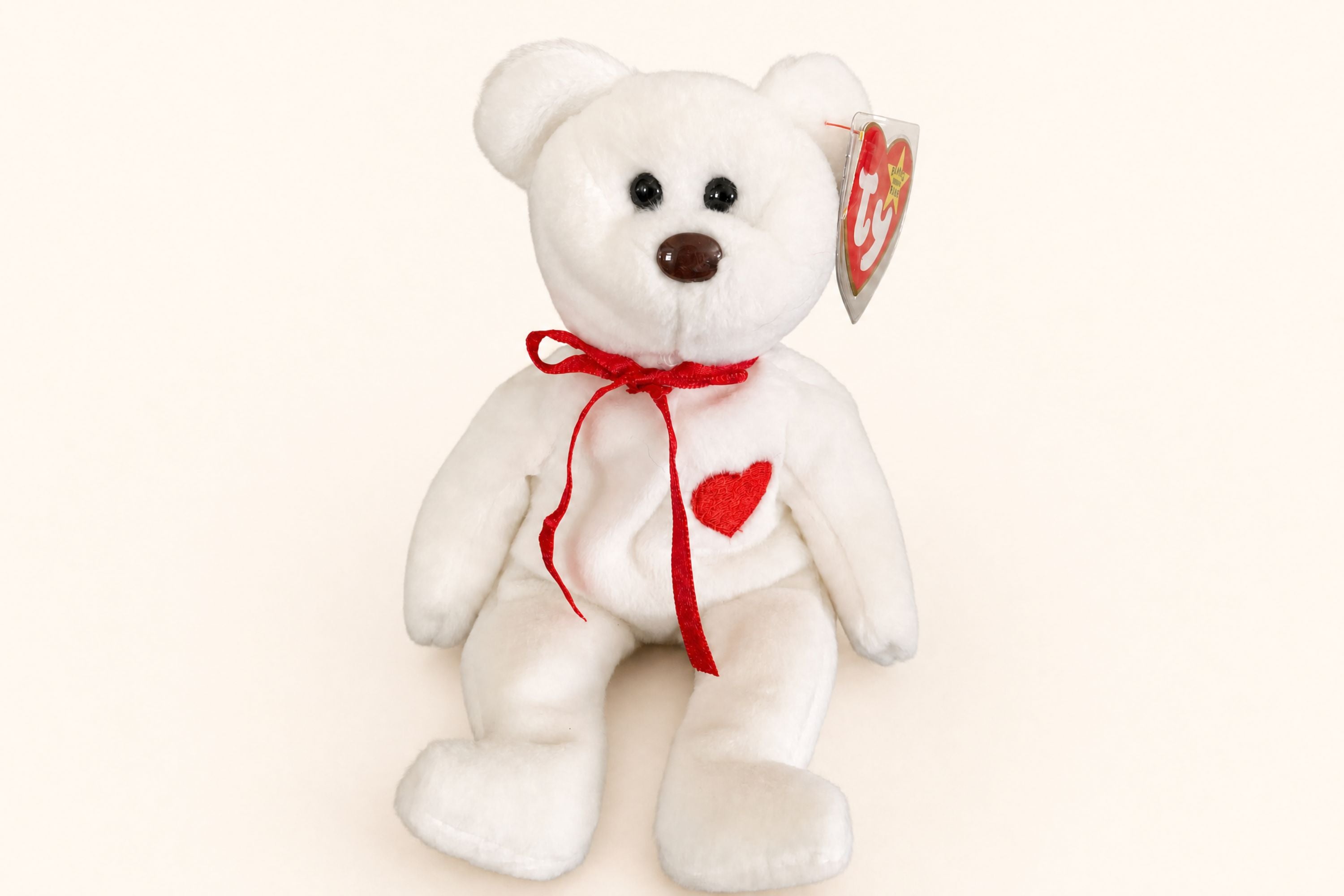 Valentino the Bear front view with his red embroidered chest heart, red ribbon, and standard brown nose.
