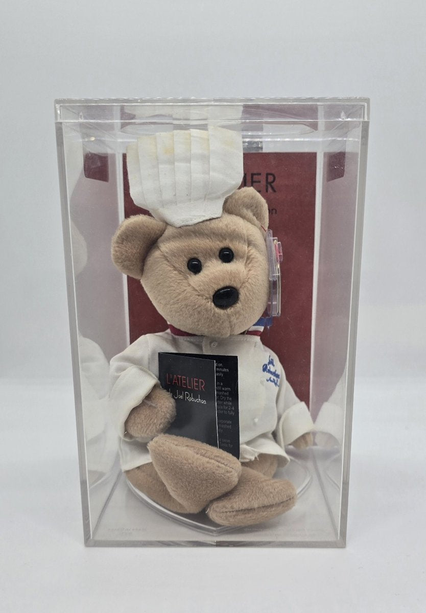 Chef Robuchon Beanie Baby bear in a chef’s hat and jacket, in a display case